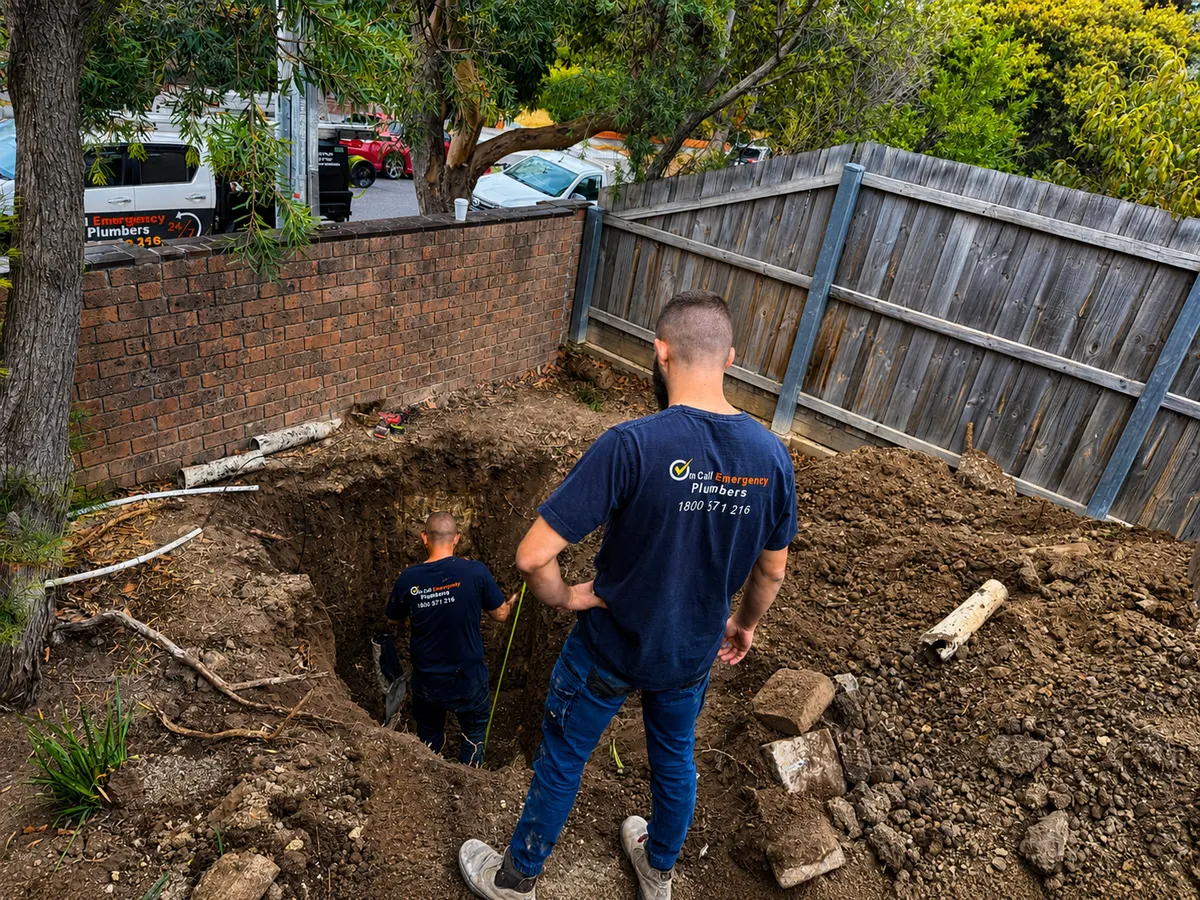 Plumber working on underground drainage